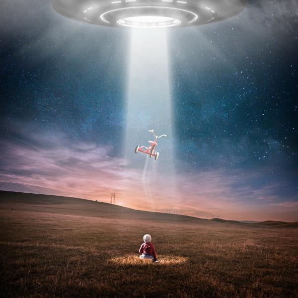 Child watching a UFO take a tricycle